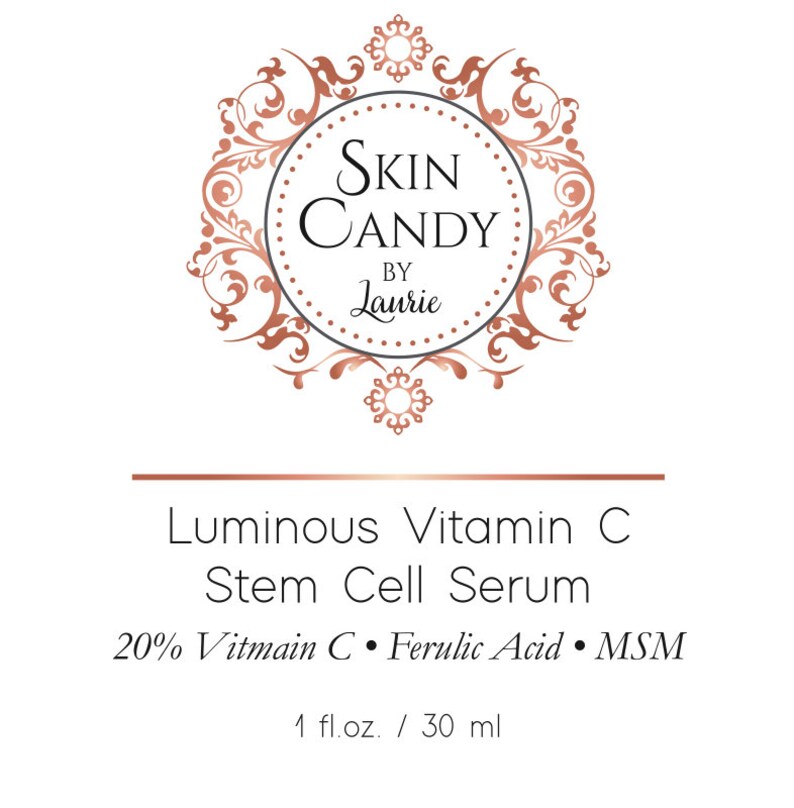 May include: A product label for "Skin Candy by Laurie" features a circular logo with ornate copper-colored flourishes. The label reads "Luminous Vitamin C Stem Cell Serum" with ingredient details and a 1 fl. oz. / 30 ml volume.