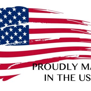 May include: Image of the American flag with a brushstroke design. The flag features red and white stripes and a blue field with white stars. The text "PROUDLY MADE IN THE USA" is below the flag.
