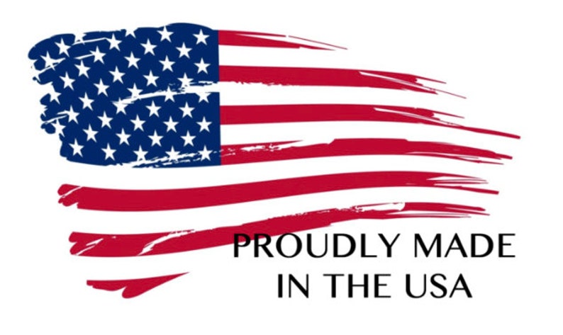 May include: Image of the American flag with a brushstroke design. The flag features red and white stripes and a blue field with white stars. The text "PROUDLY MADE IN THE USA" is below the flag.