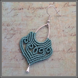 May include: Teal blue macrame earrings with a silver hook and a teardrop-shaped pendant.