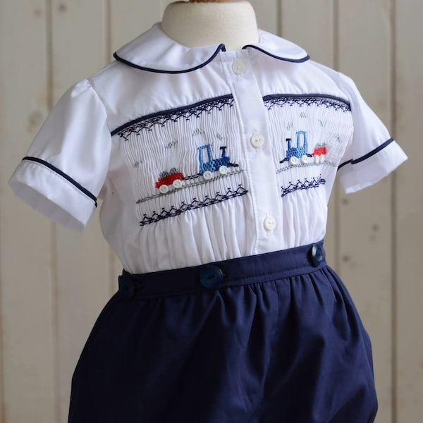 Baby boy button on suit. Smocked train. Smocked button on suit. Navy and white boys suit