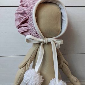 Smocked winter bonnet. Snowflake bonnet. Lined winter bonnet. 6 mo bonnet. Christmas bonnet. Bonnet with pom poms.
