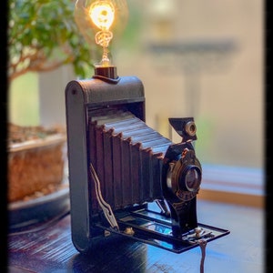 Vintage kodak foldout camera lamp.