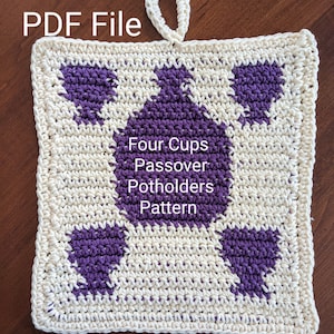 May include: A crocheted pot holder with a purple and white design. The pot holder has a loop for hanging and the text "Four Cups Passover Potholders Pattern" is written in the center. The text "@alisaayarnart" is written at the bottom of the pot holder.