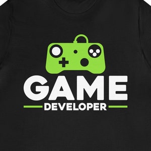 May include: Black t-shirt with a green video game controller graphic and the text "GAME DEVELOPER" in white.