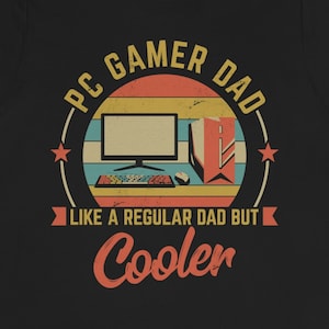 May include: Black t-shirt with a retro-style graphic that says "PC Gamer Dad Like a Regular Dad But Cooler". The graphic features a computer monitor, keyboard, and mouse.