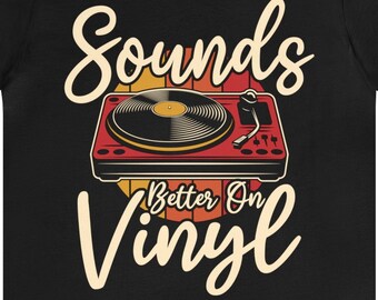 May include: Black t-shirt with a vintage-style illustration of a record player and the text "Sounds Better On Vinyl".