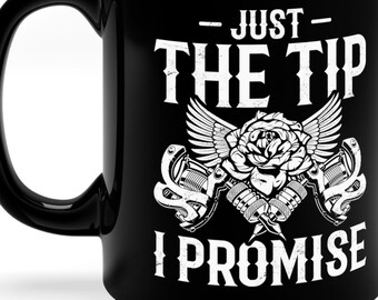 May include: Black ceramic coffee mug with a white design that says "Just the tip I promise" with a rose and two tattoo guns.