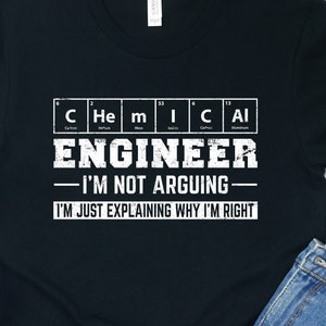 May include: Black t-shirt with the text "CHEMICAL ENGINEER - I'M NOT ARGUING - I'M JUST EXPLAINING WHY I'M RIGHT" in white. The shirt is styled with denim shorts and white trainers.