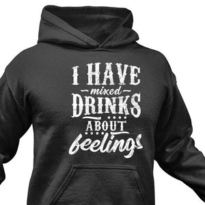 May include: A dark gray hooded sweatshirt with the text "I have mixed drinks about feelings" printed in white on the front.