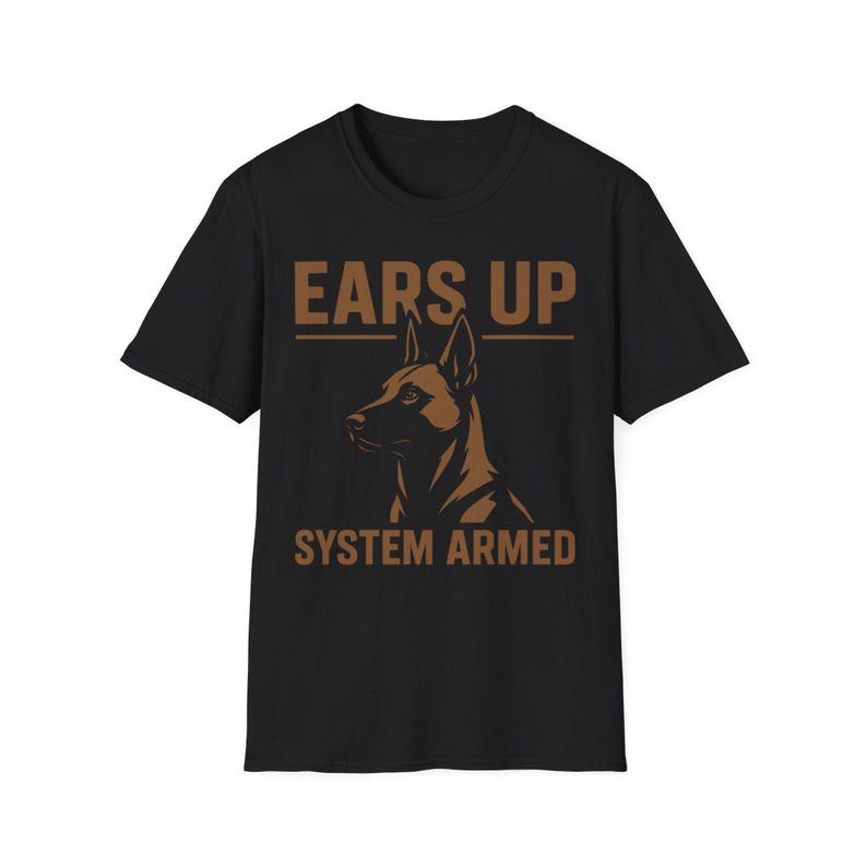 May include: Black t-shirt with a brown graphic of a dog's head and the text "EARS UP" above and "SYSTEM ARMED" below. The dog is facing left, with its ears perked up.