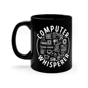 May include: Black ceramic coffee mug with a white design that says "Computer Whisperer" surrounded by computer icons.