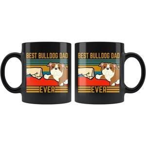 May include: Two black coffee mugs with a retro design. The mugs feature a bulldog with the text "Best Bulldog Dad Ever".