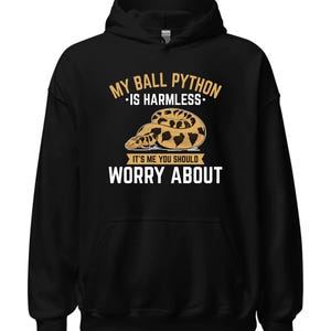 May include: Black hoodie with a white graphic that says "My Ball Python - Is Harmless - It's Me You Should Worry About". The graphic also features a brown and yellow ball python.