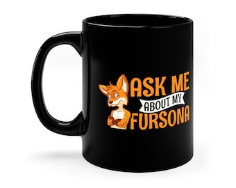 May include: Black coffee mug with a cartoon fox and the text "Ask me about my fursona".