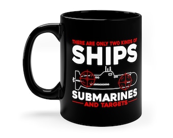 May include: Black coffee mug with a white graphic that says "There are only two kinds of ships: submarines and targets". The graphic also includes a black and white submarine with red target sights.