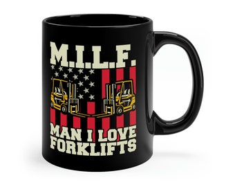 May include: Black ceramic mug with the text "M.I.L.F. MAN I LOVE FORKLIFTS" in white. The design includes a stylized American flag with two yellow forklifts. The mug has a black handle and a white background.