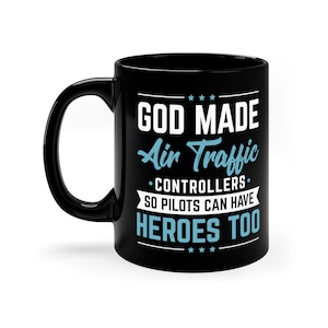 May include: Black coffee mug with white text that reads "God Made Air Traffic Controllers So Pilots Can Have Heroes Too".
