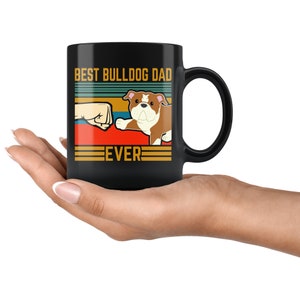 May include: Black coffee mug with a retro design featuring a bulldog and the text "Best Bulldog Dad Ever".