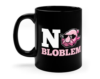 May include: Black coffee mug with a white "N" and the text "BLOBLEM" in pink. A pink cartoon fish with sunglasses is next to the "N".