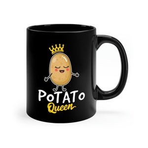 May include: Black ceramic mug with a white design of a cartoon potato wearing a gold crown and the text "POTATO Queen".