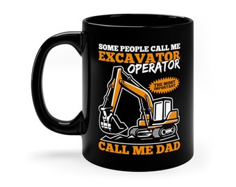 May include: Black ceramic mug with a white handle. The mug has the text "SOME PEOPLE CALL ME EXCAVATOR OPERATOR CALL ME DAD" in white and orange. An orange and white excavator graphic is in the center, with the words "THE MOST IMPORTANT" in a starburst.