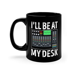May include: Black coffee mug with a white graphic of a soundboard and the text "I'll be at my desk".