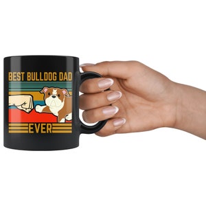 May include: Black coffee mug with a retro design featuring a bulldog and the text "Best Bulldog Dad Ever".