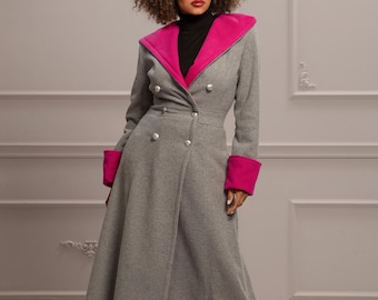 May include: A long grey coat with a pink collar and cuffs. The coat has a double-breasted closure and a fitted waist.