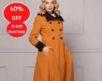 May include: A long, mustard yellow coat with a black collar and cuffs. The coat has a double-breasted closure with black buttons and a flared skirt. The model is wearing white pants and beige heels. 40% OFF M SIZE MUSTARD