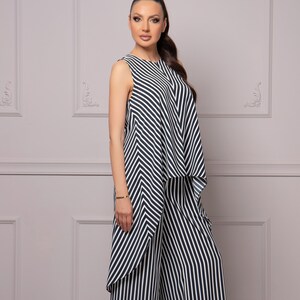 May include: A black and white striped jumpsuit with a wide-leg pant style.