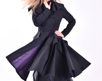 May include: A black coat with a purple lining and a black tulle skirt. The coat has a double-breasted closure and a high collar.