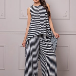May include: A black and white striped sleeveless top and wide-leg pants set.