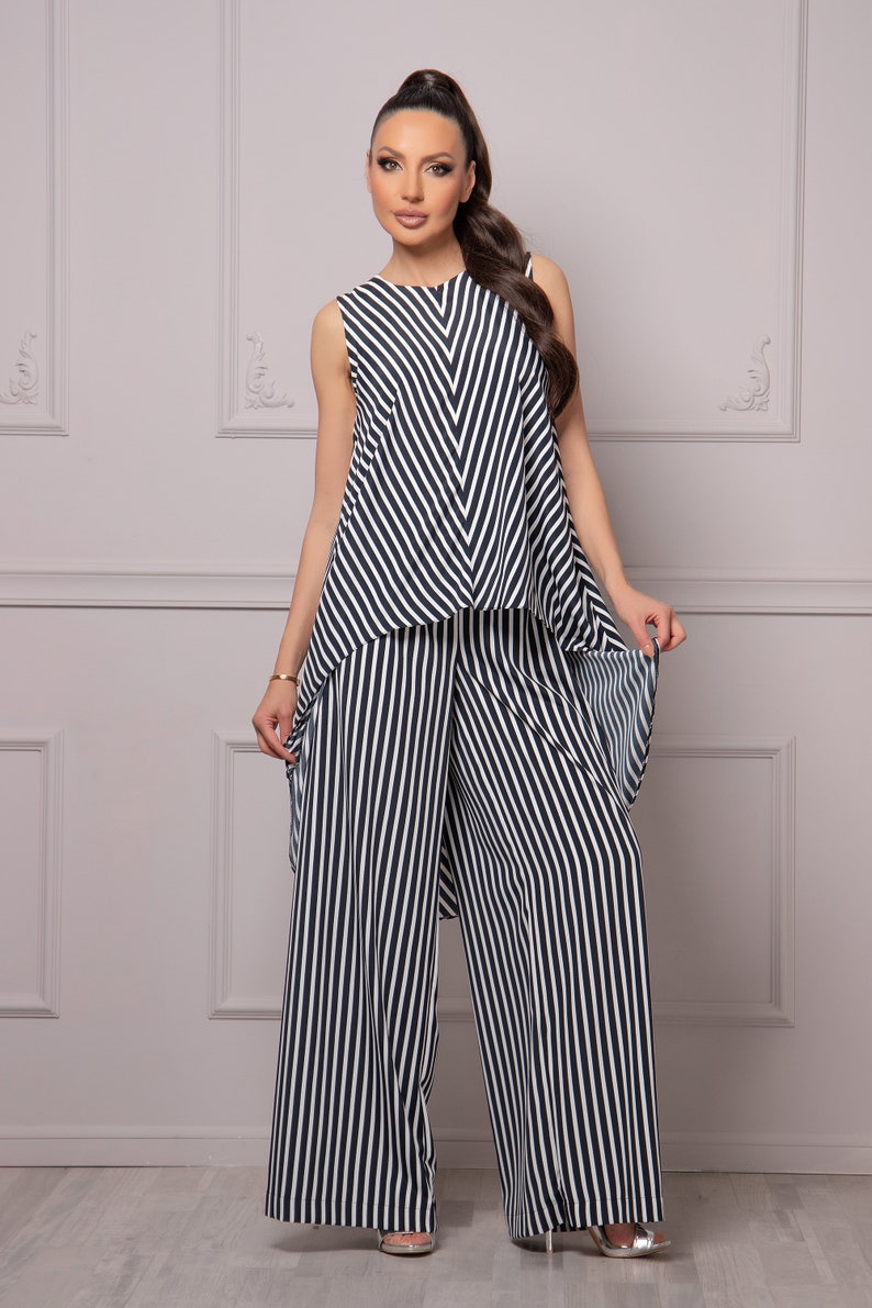 May include: A black and white striped sleeveless top and wide-leg pants set.