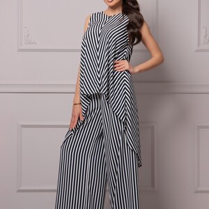 May include: A black and white striped jumpsuit with a sleeveless top and wide-leg pants.