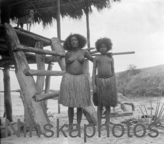 1920s Papua New Guinea, Mother and Daughter in front of their hut, antique photo reprint, wall decor, black and white photography