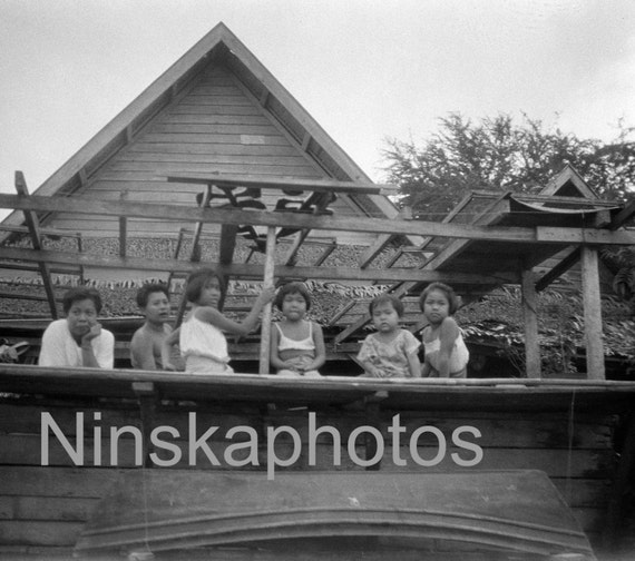 A Family  by the river in Bangkok, Thailand by J. Dearden Holmes, 1920s antique photo reprint