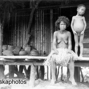 1920s Papua New Guinea - Woman and Boy in front of Hut Antique Photo Reproduction - Vintage Photography - Black and White