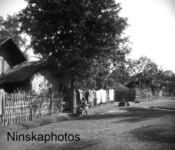 1925 Village Barber at the Gate, Hsinbo, on the Irrawaddy, Myanmar, Burma by J. Dearden Holmes, Asia, 1920s antique photo reprint