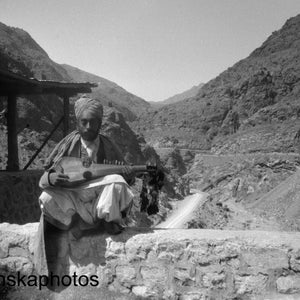 A Musician along the Khyber Pass near Landi Kotal - India - Pakistan - Vintage Photo Reproduction by James Dearden Holmes