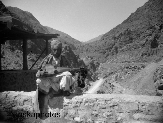 A Musician along the Khyber Pass near Landi Kotal - India - Pakistan - Vintage Photo Reproduction by James Dearden Holmes