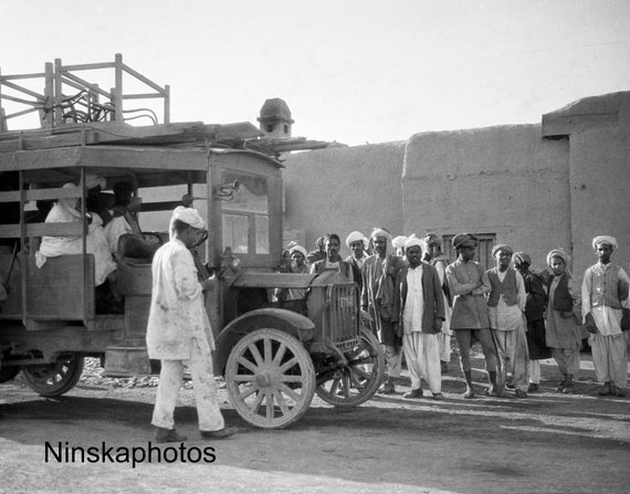 Locals and Bus along Khyber Pass - India - Pakistan - Vintage Photo Reproduction by James Dearden Holmes