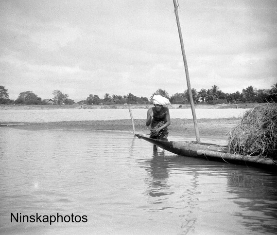 1925 Man washing clothes in Boat on the Irrawaddy, Myanmar, Burma by J. Dearden Holmes 1920s antique photo reprint