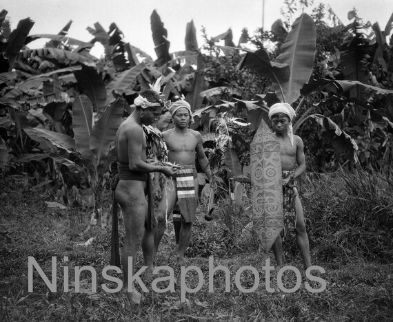 Dayak Warriors in traditional dress, Kuching, Sarawak, Borneo, Malaysia by J. Dearden Holmes, 1920s antique photo reprint