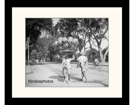 Man carrying Jars, Street Scene in Benares, Varanasi, India Vintage Photo Reproduction by James Dearden Holmes - Historical Photography
