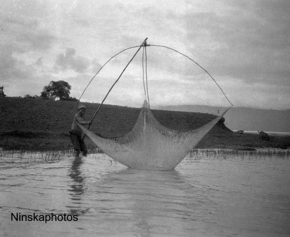 Fisherman lowering his net in Fishing Village near Lake Toba - Sumatra, Indonesia - 1925 - Fine Art Antique Photo Print - Vintage Photo