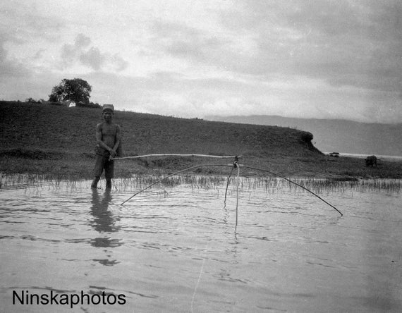 Fisherman lowering his net in Fishing Village near Lake Toba - Sumatra, Indonesia - 1925 - Fine Art Antique Photo Print - Vintage Photo
