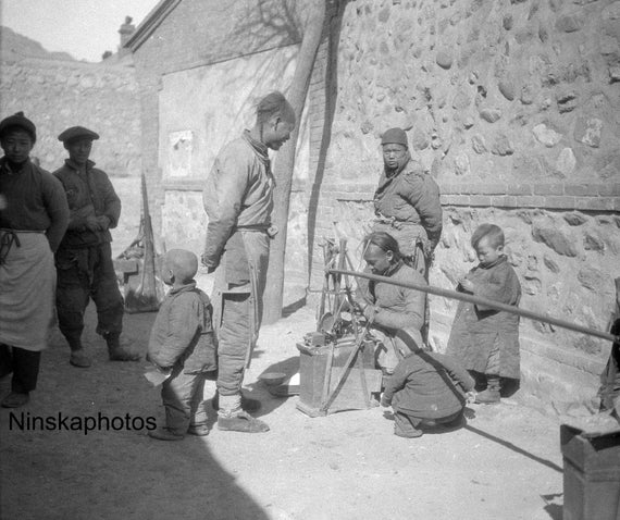 1920s Man mending old china - Street Scene in Nankow - China Antique Photo Reproduction - Vintage Photography - Black and White