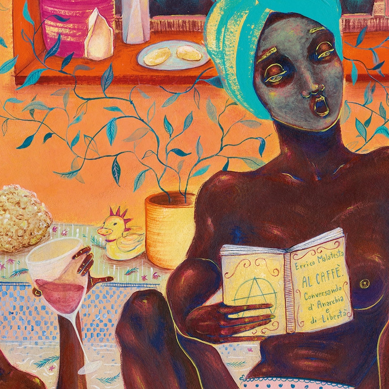 May include: A woman with a turquoise head wrap sits on a patterned sofa, reading a book titled "AL CAFFE. Conversando d'Anarchia e di Libert&agrave;" by Errico Malatesta. She is wearing pink and white patterned underwear. A glass of wine sits on the table in front of her.