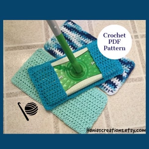 May include: Crochet pattern for a mop head cover. The cover is made in a turquoise blue and light blue color scheme. The pattern is available as a PDF download. The image shows the cover on a mop head and includes a crochet hook and yarn.